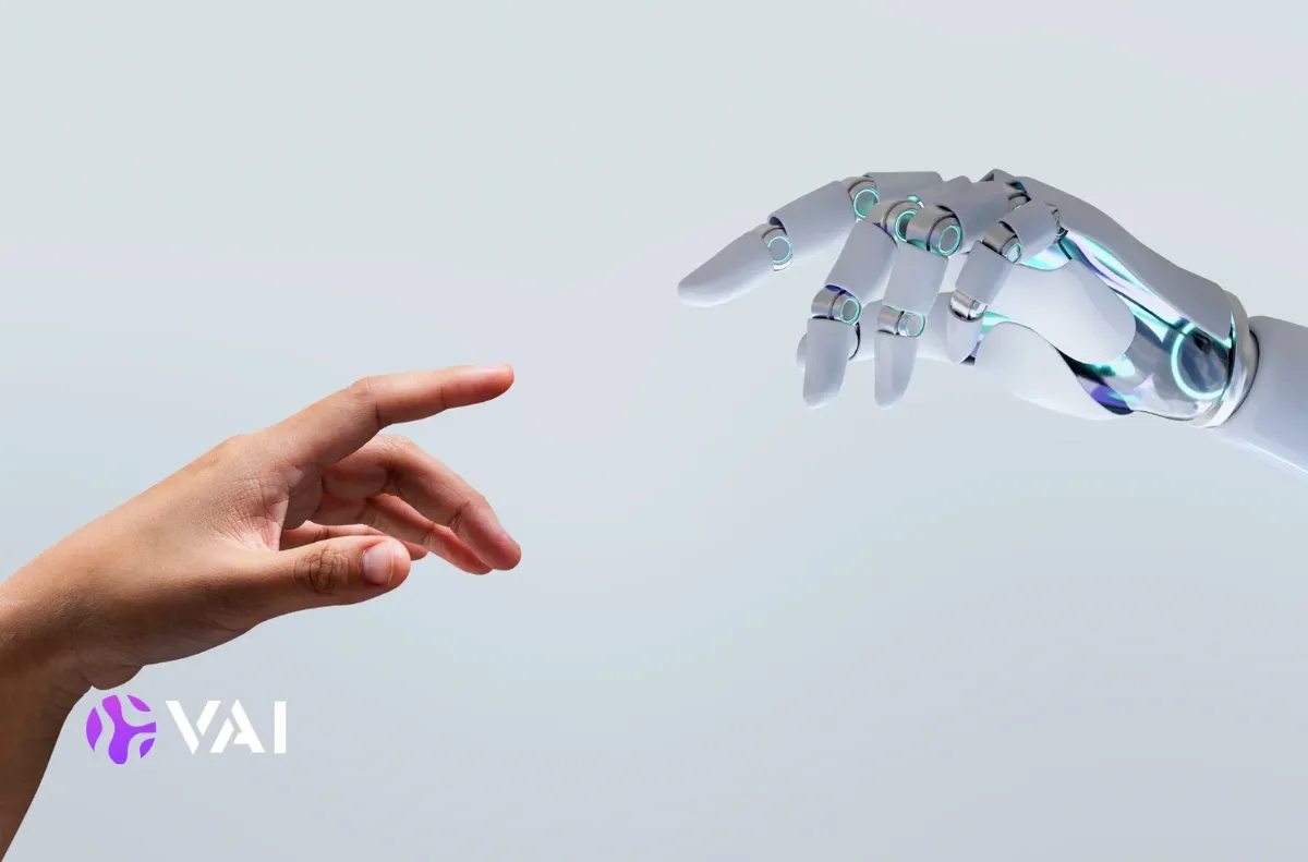 Human hand reaching toward a robotic hand, illustrating the behavioural drivers of performance